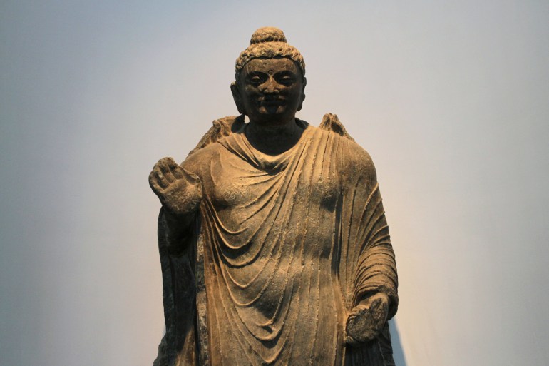 A stone Buddha statue displayed at the Kabul National Museum