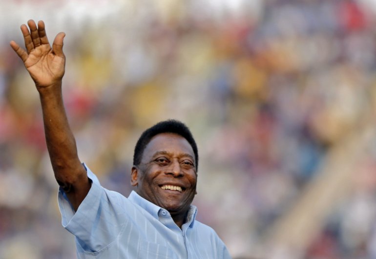 Brazilian football legend Pele waves to a crowd