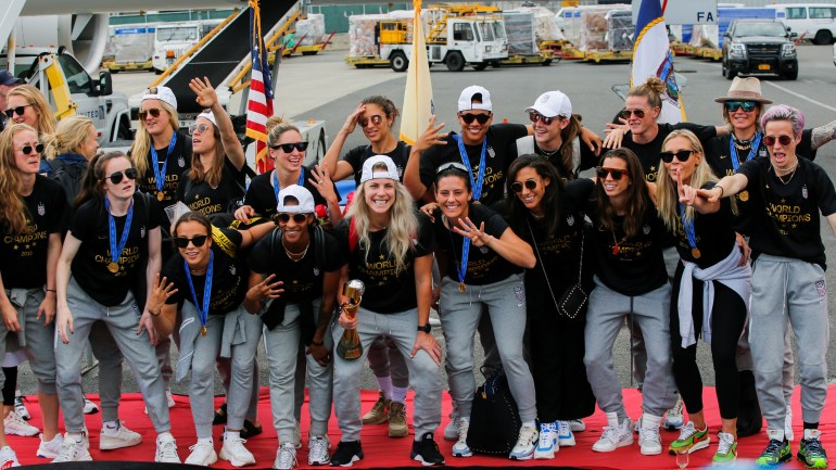 U.S. women soccer players pose for a picture with the Trophy for the FIFA Women's World Cup