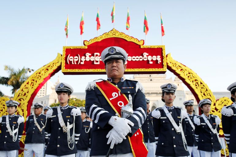 A marching band waits to perform during Union day celebrations in Yangon, Myanmar
