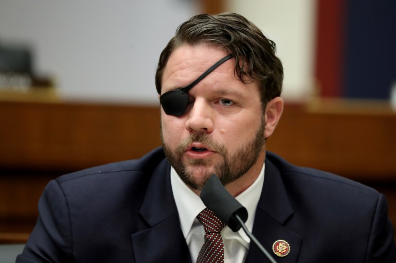 A former Navy SEAL, Representative Dan Crenshaw wears a black eye patch after losing an eye to an IED in Afghanistan.