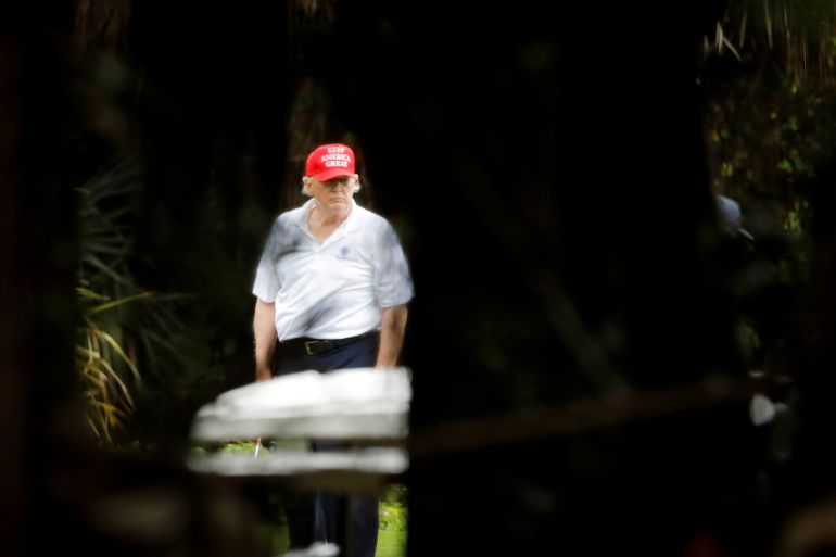 U.S. President Donald Trump plays golf at the Trump International Golf Club in West Palm Beach, Florida, U.S