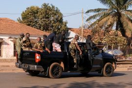 Armed soldiers move on the main artery of the capital after heavy gunfire around the presidential palace in Bissau, Guinea Bissau February 1, 2022