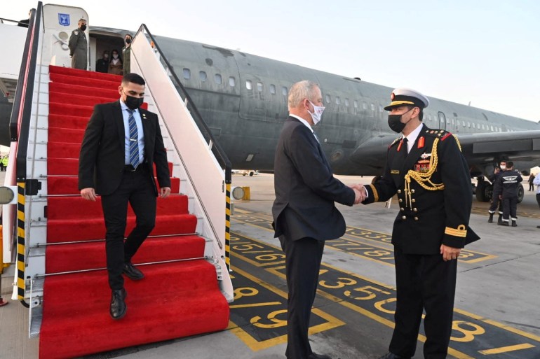 Israeli Defence Minister Benny Gantz is greeted by a Bahrain military official during an official visit, at Bahrain International Airport