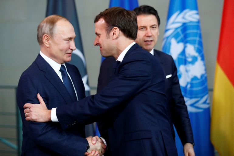 Russian President Vladimir Putin shakes hands with French President Emmanuel Macron in Berlin, Germany, January 19, 2020.