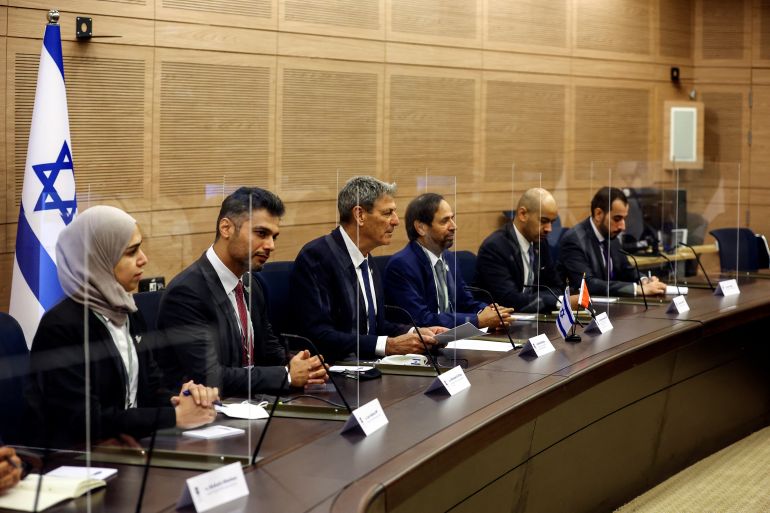 Ali Rashid Al Nuaimi, chairman of defense affairs, interior and foreign affairs committee of the UAE Federal National Council sits with Ram Ben Barak, chairman of the Knesset, Israel's parliament, foreign affairs and defence committee, and other officials in Jerusalem