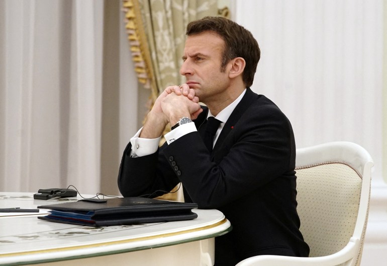French President Emmanuel Macron attends a meeting with Russian President Vladimir Putin in Moscow