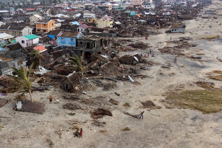 An aerial view shows damaged houses and debris on the beach, in the aftermath of Cyclone Batsirai