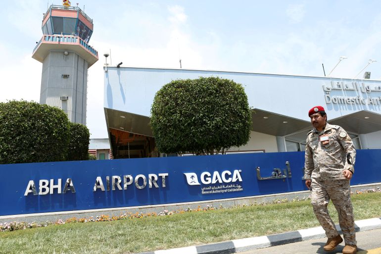 Saudi security officer walks past Saudi Arabia's Abha airport.