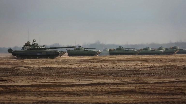 Military vehicles drive during the Union Courage 2022 joint military exercise of the armed forces of Russia and Belarus, at the Brestsky training ground in Brest Region, Belarus.