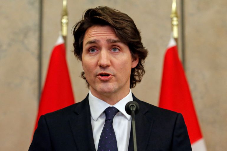 Canadian PM Justin Trudeau speaks at a podium