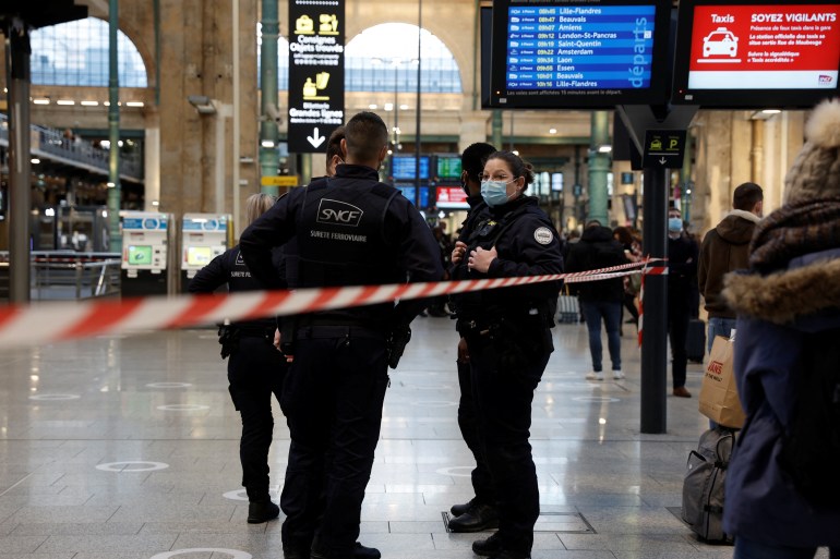 French police secure the scene after they killed a person who attacked them with a knife at Gare du Nord station in Paris