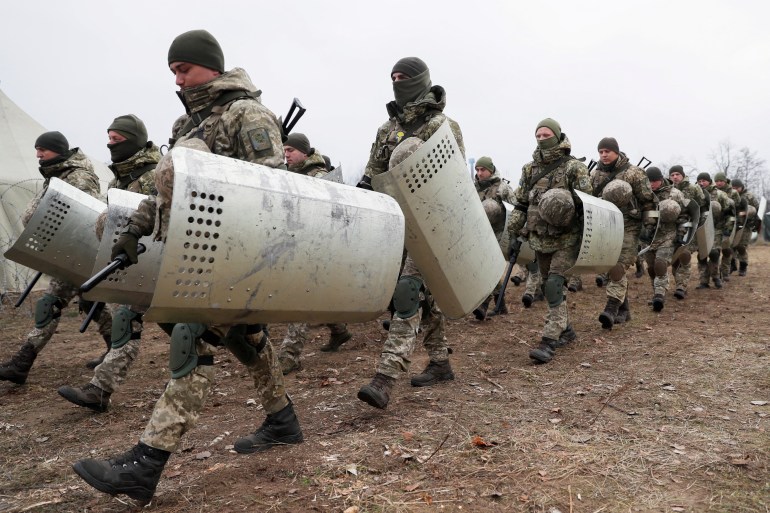 Members of the Ukrainian State Border Guard Service attend a training session near the border with Belarus and Poland in Volyn region, Ukraine
