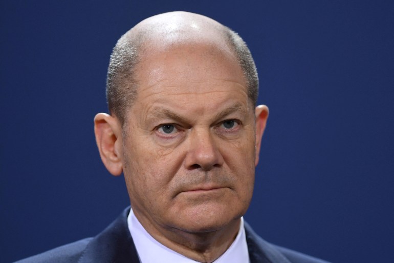 German Chancellor Olaf Scholz looks on
