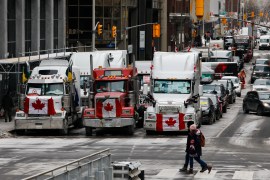 Vehicles are seen on a street as truckers