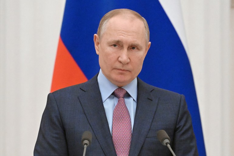 Russian President Vladimir Putin attends a joint news conference