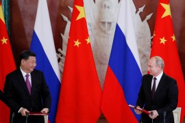 Russian President Vladimir Putin and his Chinese counterpart Xi Jinping look on during a signing ceremony in Moscow, Russia [File: Evgenia Novozhenina/Reuters]