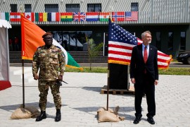 Ivory Coast's Chief of the Defence Staff Lassina Doumbia stands with U.S Ambassador Richard K. Bell as they prepare to give a news briefing during the opening ceremony of the U.S. sponsored Flintlock exercises at the site of the new French-backed international counter-terrorism academy in Jacqueville, Ivory Coast