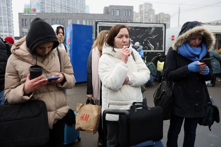 People wait at a bus station in Kyiv, Ukraine to go to western parts of the country