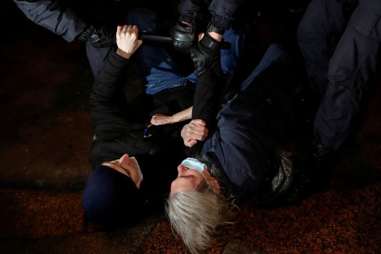 Police officers detain demonstrators during an anti-war protest, after Russian President Vladimir Putin authorized a military operation in eastern Ukraine, in Saint Petersburg, Russia, February 24, 2022. REUTERS/Anton Vaganov TPX IMAGES OF THE DAY