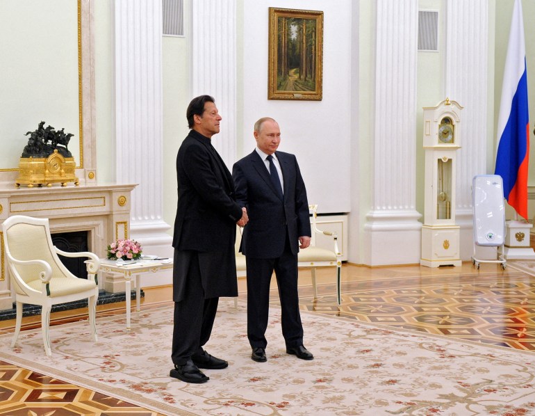 Russian President Vladimir Putin shakes hands with Pakistan's Prime Minister Imran Khan during a meeting in Mosco
