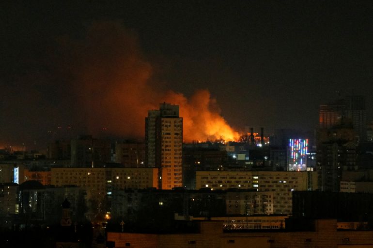 Smoke and flames rise in the night sky during the shelling near Kyiv.