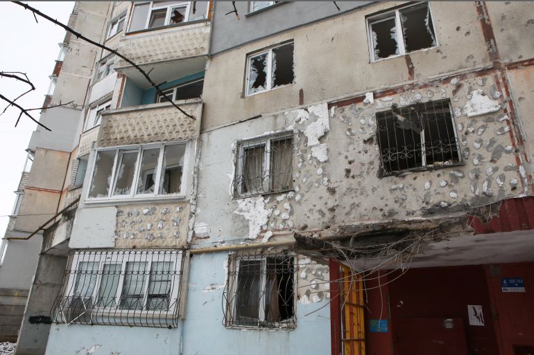 A damaged residential building in Kharkiv