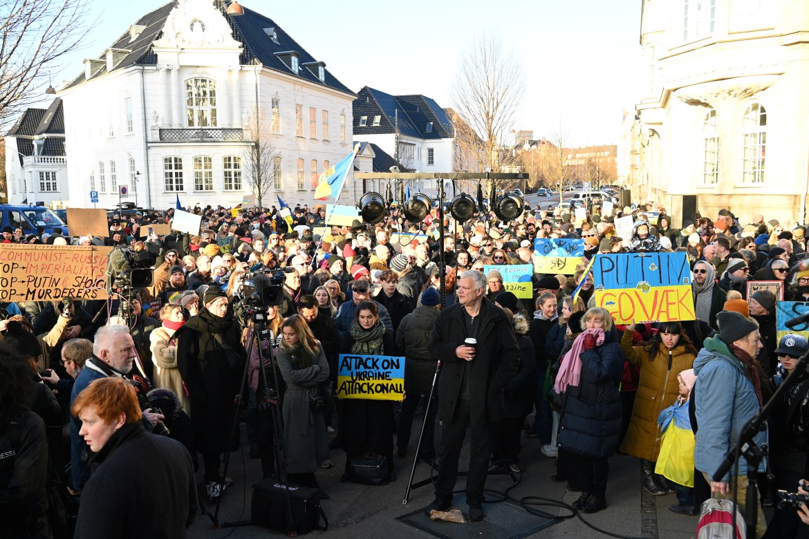A crowd (estimated to 10,000 people), participate in a protest demonstration in front of the Russian Embassy in Copenhagen, Denmark,