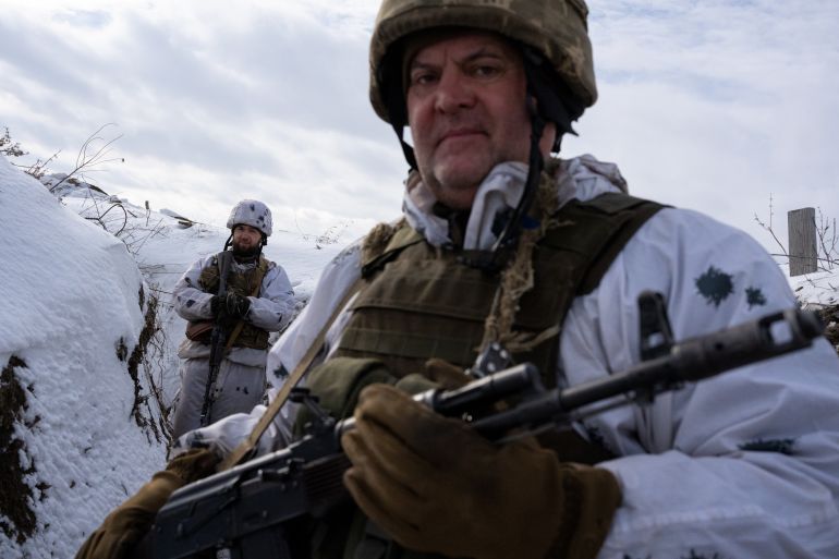 Ukrainian servicemen are seen along the front line outside of Svitlodarsk