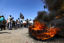 Sudanese people stage a protest in Khartoum