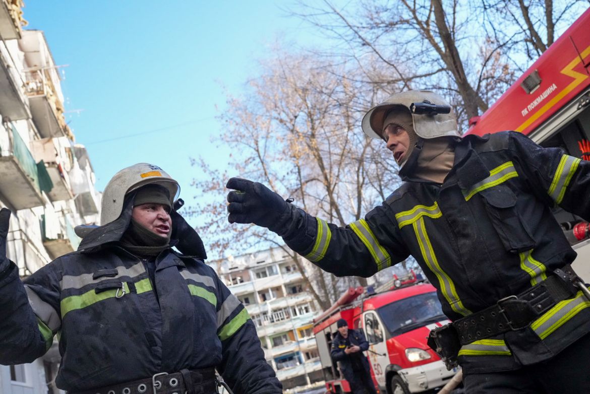 Ukrainian firefighters arrive after an airstrike hit an apartment complex in Chuhuiv, Kharkiv Oblast, Ukraine