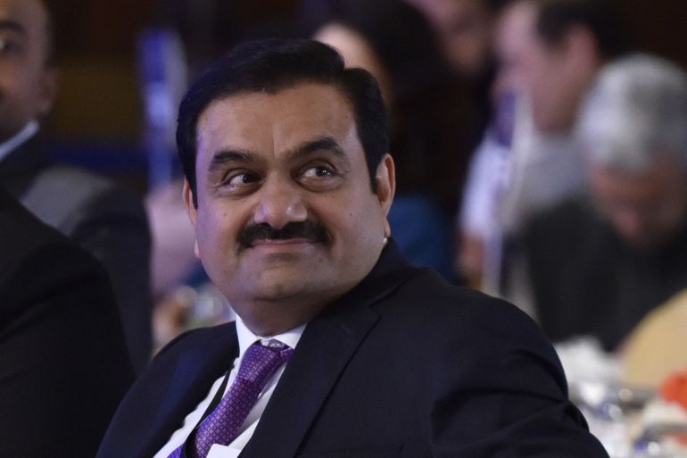 A smiling Gautam Adani in a suit