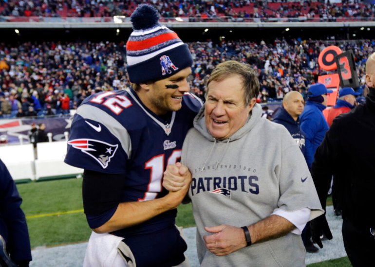 New England Patriots quarterback Tom Brady, left, celebrates with head coach Bill Belichick after defeating the Miami Dolphins 41-13 in an NFL football game Sunday, Dec. 14, 2014, in Foxborough, Massachussetts.