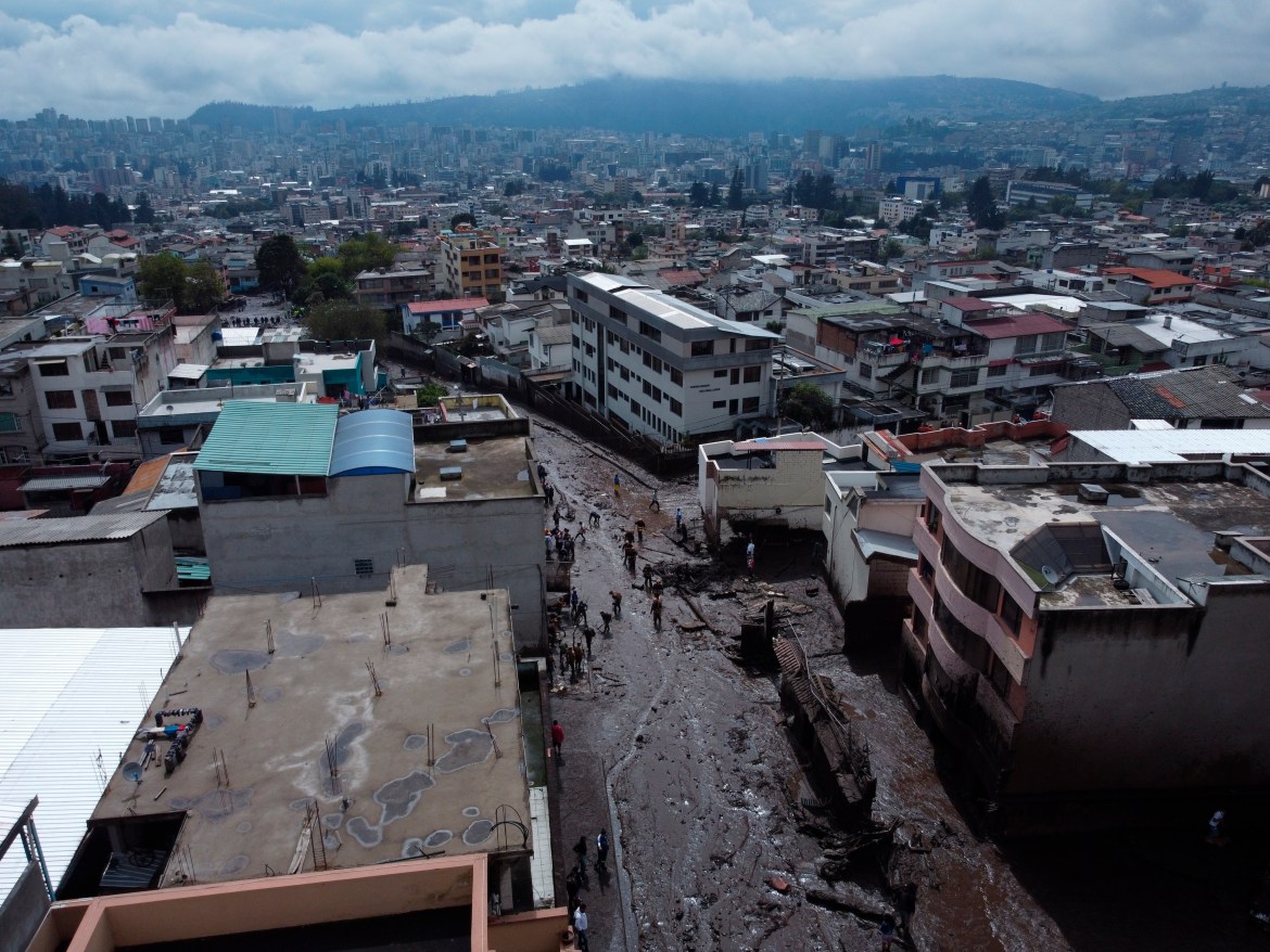 A street is filled with mud after a rain-weakened hillside collapsed and brought waves of mud over La Gasca area of Quito