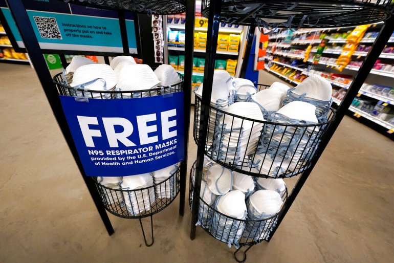 A product stall filled with free N95 respirator masks, provided by the U.S. Department of Health and Human Services, sits outside the pharmacy at this Jackson, Miss., Kroger grocery store.