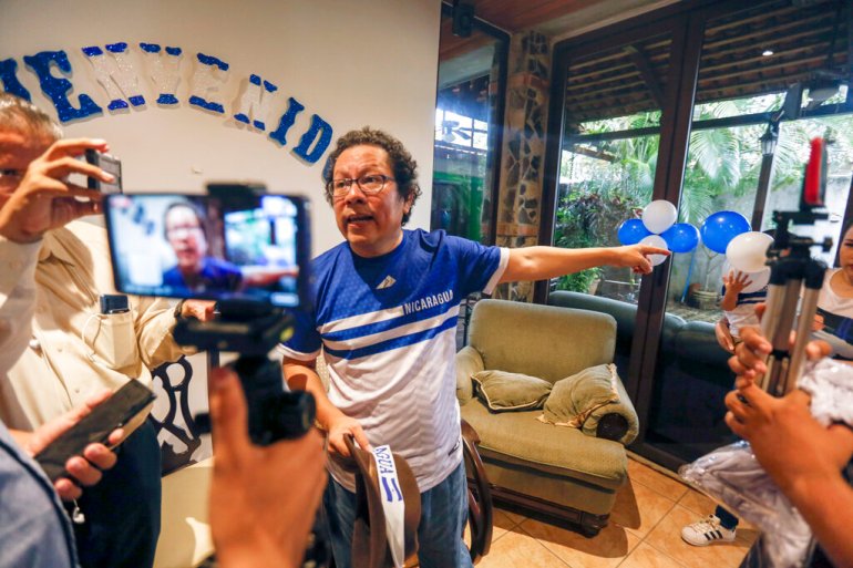 Nicaraguan journalist Miguel Mora speaks to the press after his release from prison, at his home in Managua, Nicaragua, in 2019.