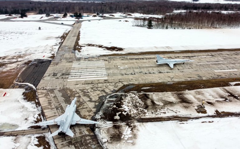 In this photo taken from video and released by the Russian Defense Ministry Press Service on Saturday, February 5, 2022, a pair of Tu-22M3 bombers of the Russian air force taxi before takeoff at an air base in Russia. Two Tu-22M3 long-range bombers of the Russian air force performed a patrol mission over Belarus on Saturday amid the tensions over Ukraine. (Russian Defense Ministry Press Service via AP)