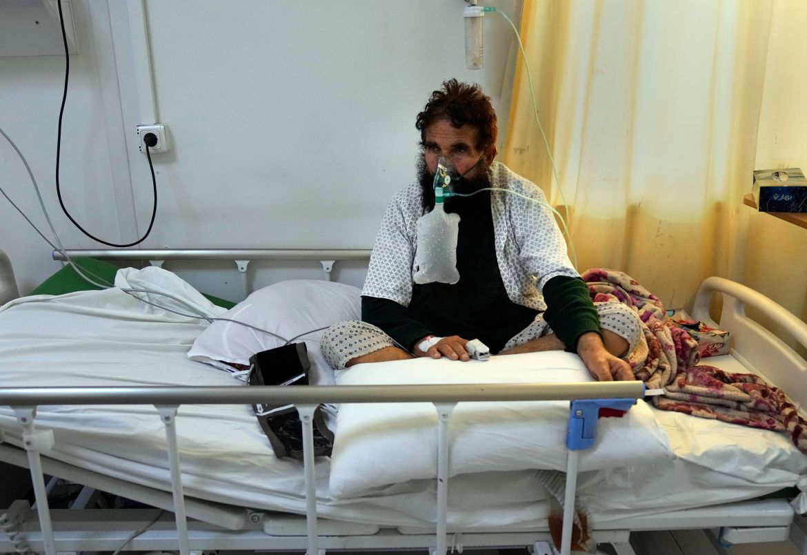 An Afghan patient who infected with COVID-19 sits on a bed in the intensive care unit