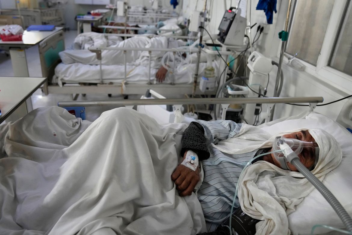 An Afghan patient infected with COVID-19 lies on a bed in the intensive care unit of the Afghan Japan Communicable Disease Hospital