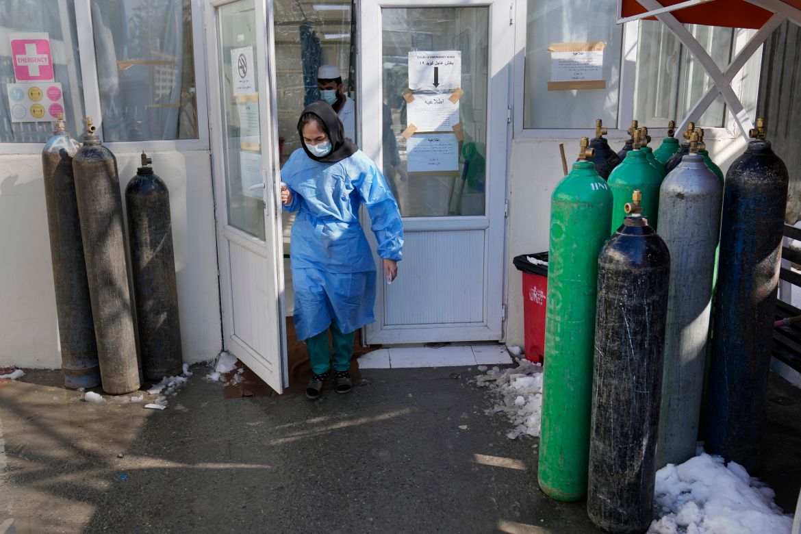 A nurse exits the COVID-19 intensive care unit of the Afghan Japan Communicable Disease Hospital