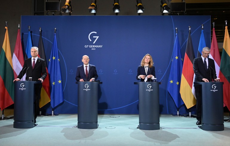 German Chancellor Olaf Scholz, center left, speaks during a press conference with the leaders of the three Baltic states