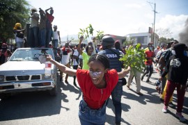 Factory workers chant anti-government slogans during a protest demanding a salary increase, in Port-au-Prince, Haiti