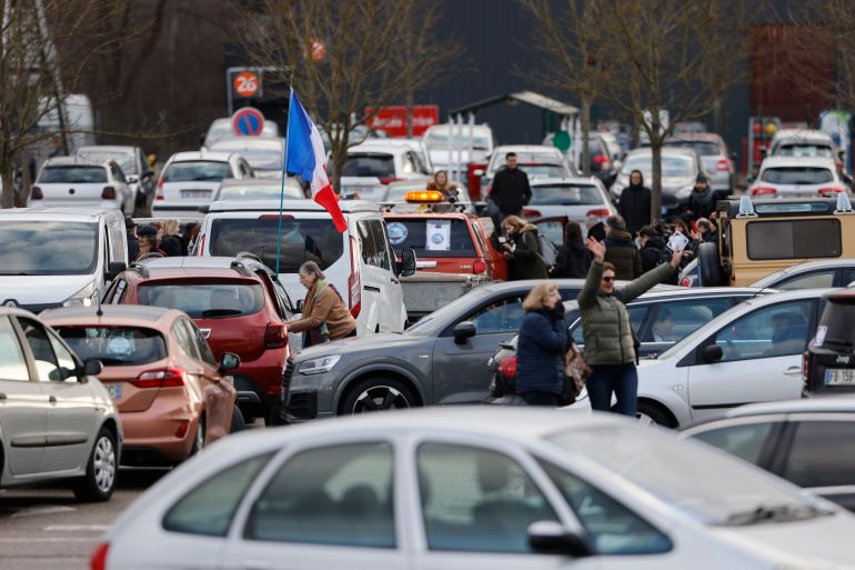 Protesters are seen gathering for a convoy before heading to Paris