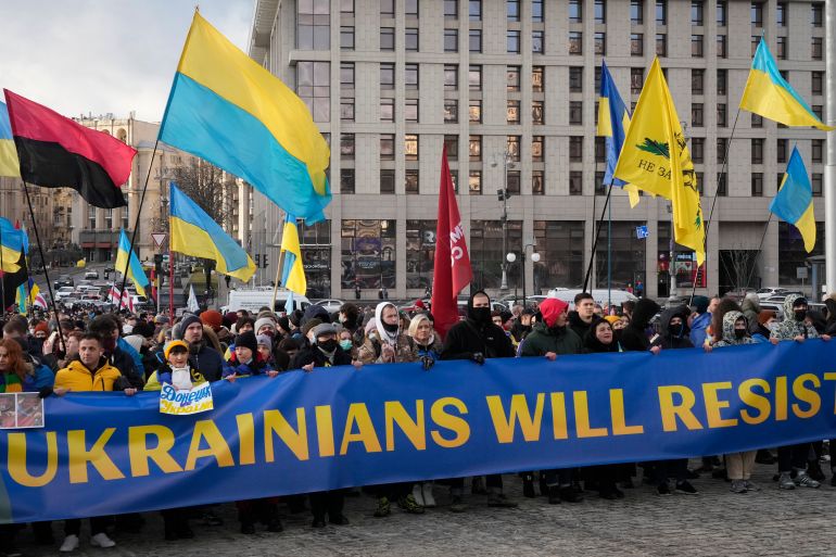 Ukrainians attend a rally in the capital Kyiv against Russian aggression