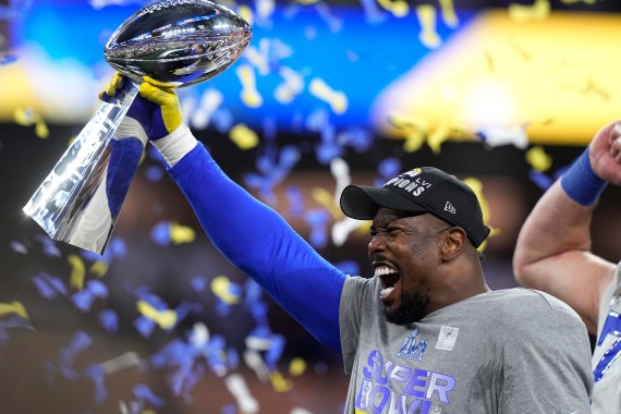 Los Angeles Rams outside linebacker Von Miller holds up the Lombardi Trophy
