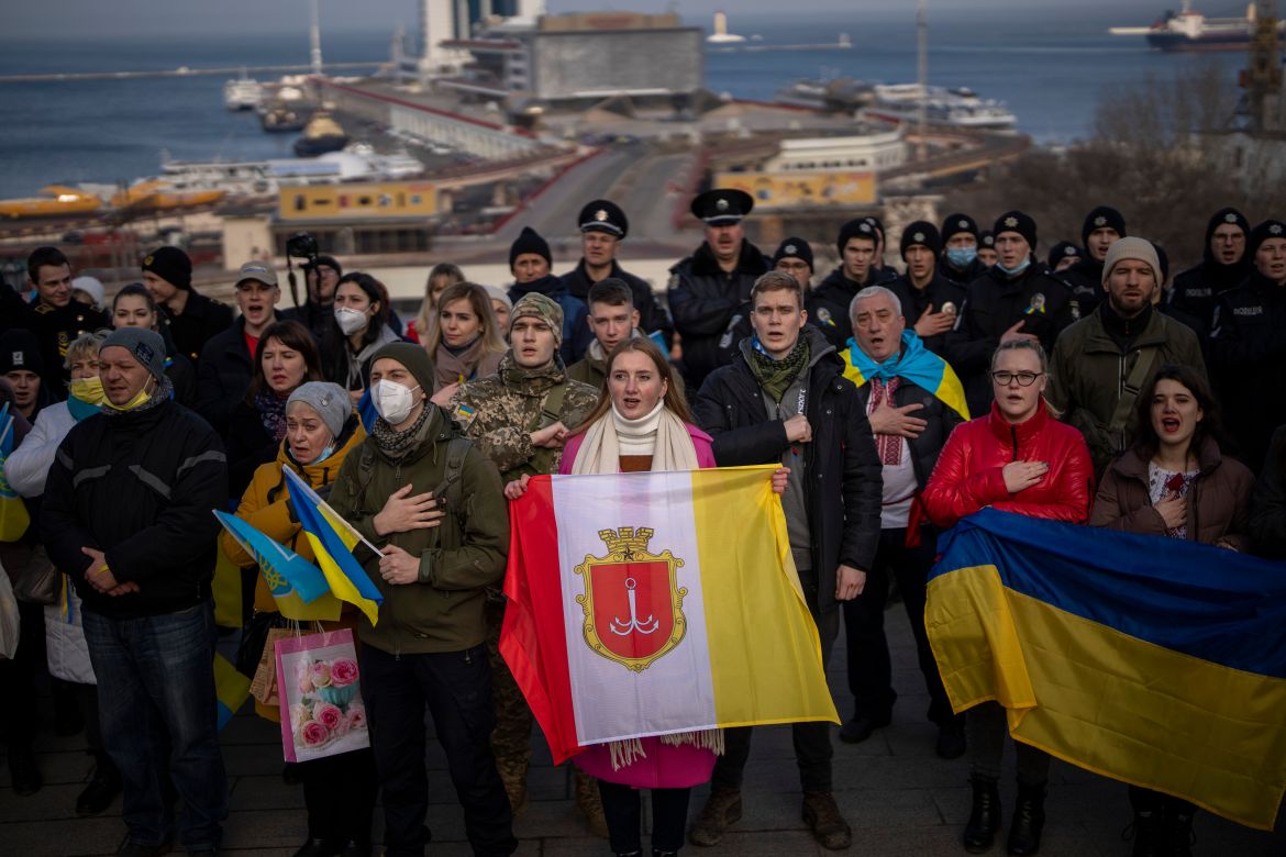 People sing the national anthem as they gather in front of the port to celebrate a Day of Unity in Odessa, Ukraine
