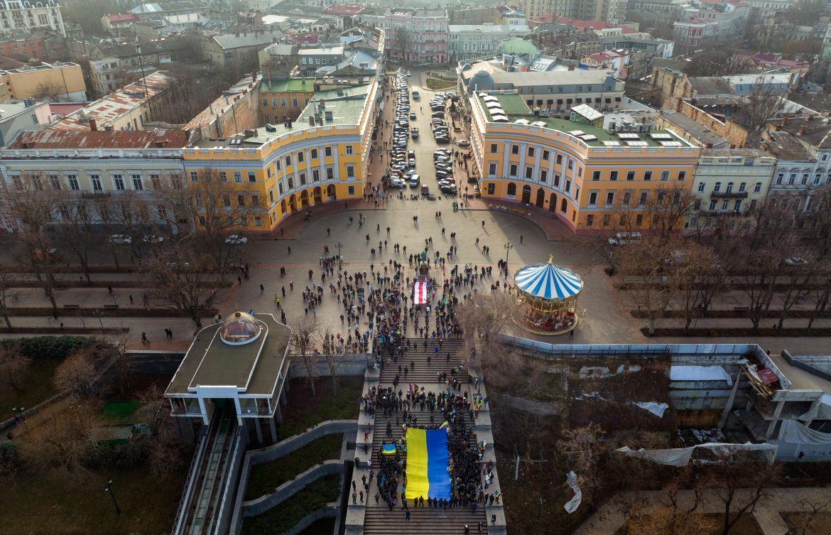 Ukrainians march holding a national flag to celebrate a Day of Unity in Odessa, Ukraine