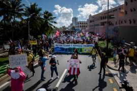 Demonstrators from the public education sector march to Fortaleza street in San Juan, Puerto Rico