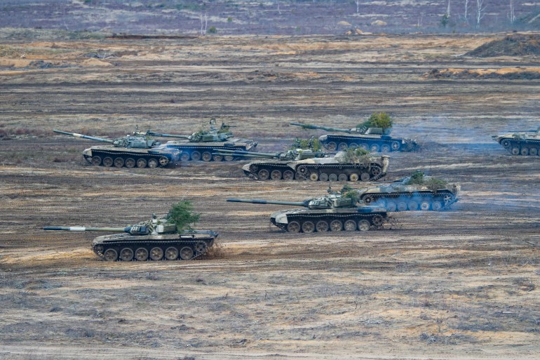 Tanks and armored vehicles move during the Union Courage-2022 Russia-Belarus military drills at the Obuz-Lesnovsky training ground in Belarus