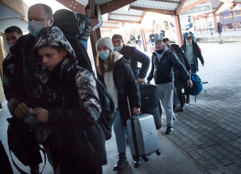 People arrive by train from Kharkiv, in the east of Ukraine, in Przemysl, Poland